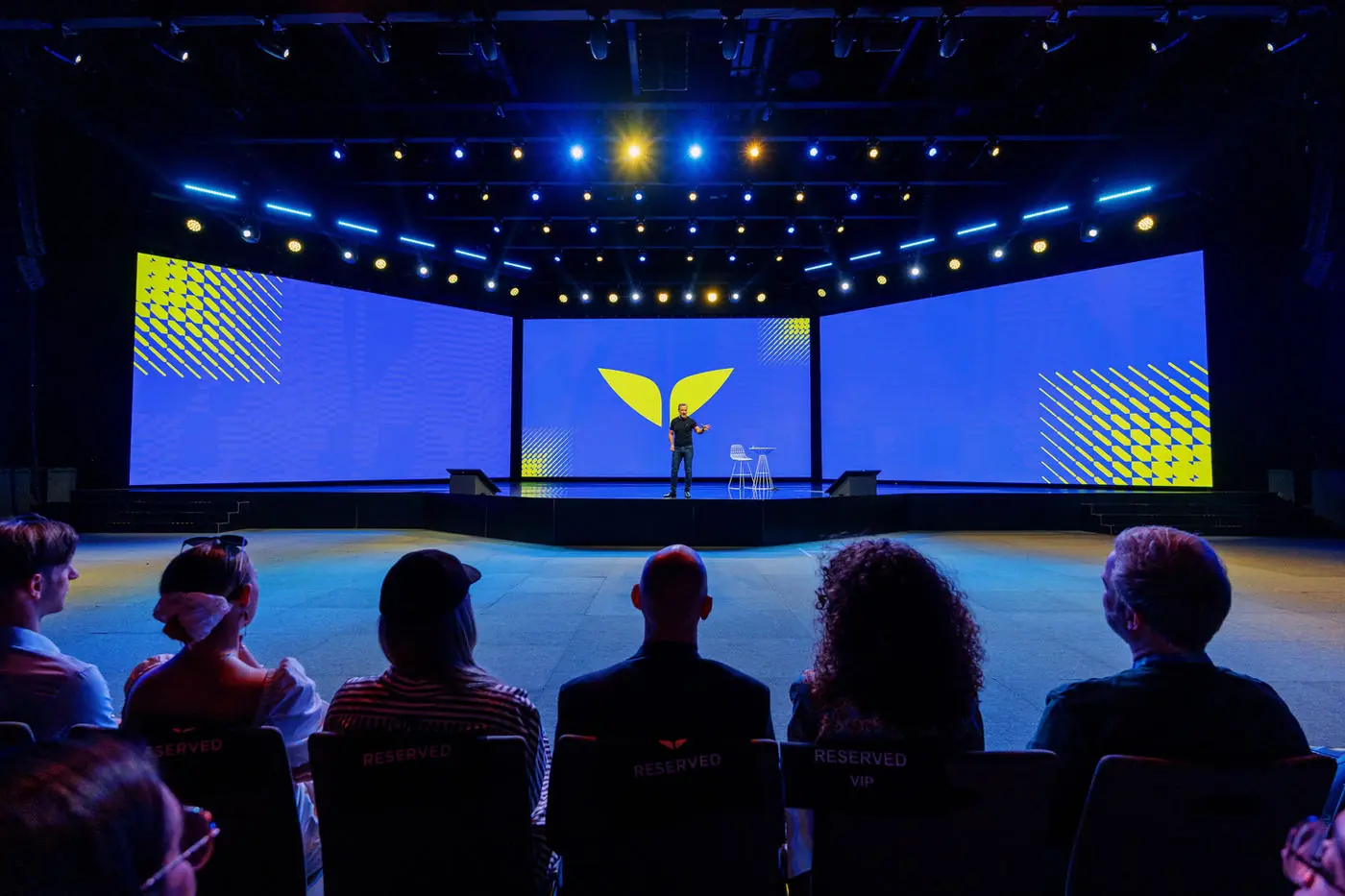 Audience facing the full stage