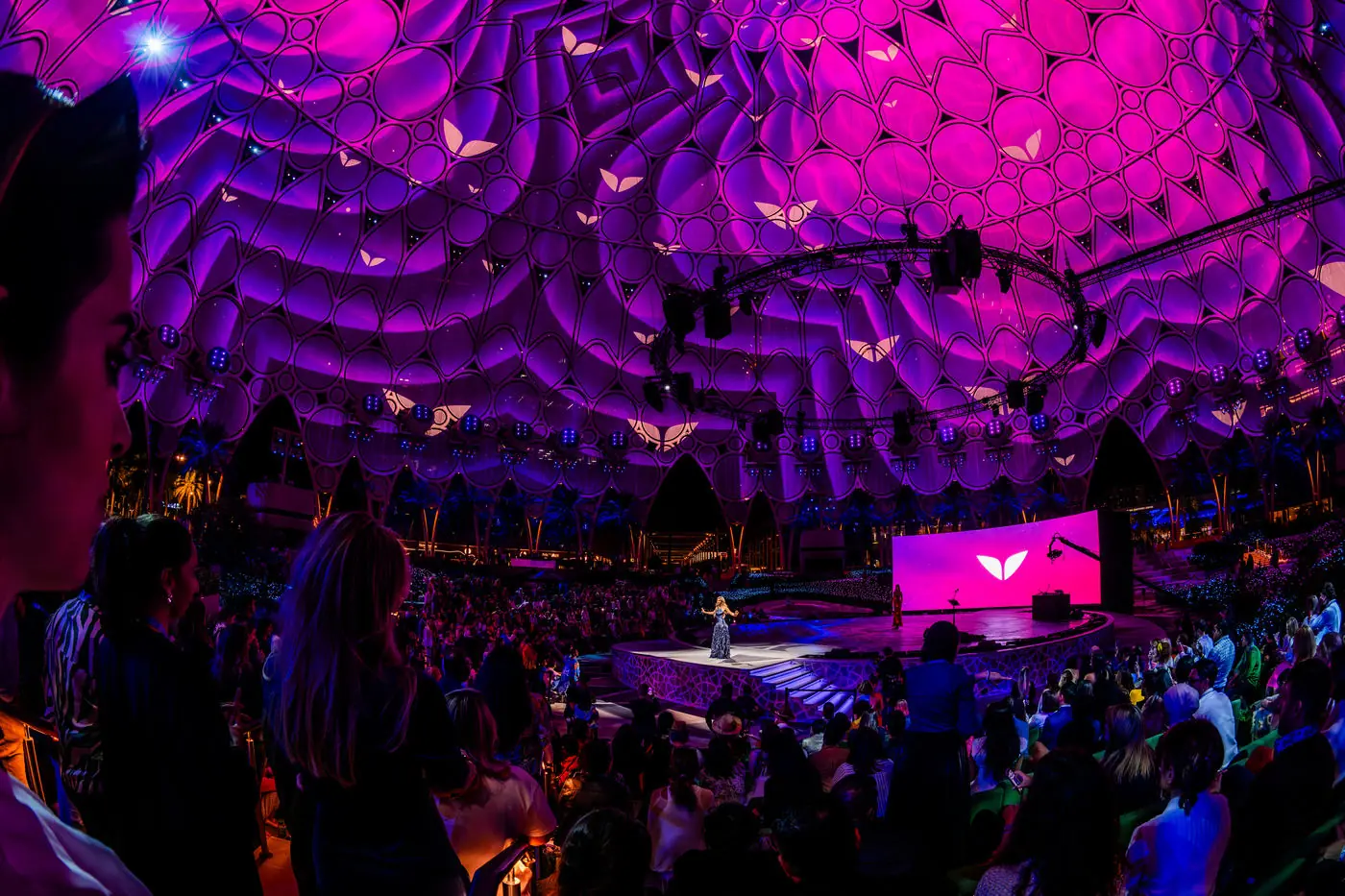 Violet-lit venue interior