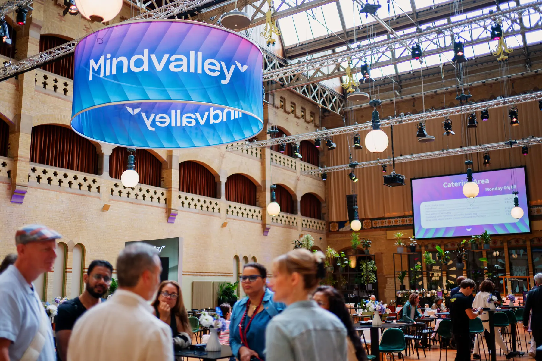Suspended Mindvalley drum sign over the dining hall