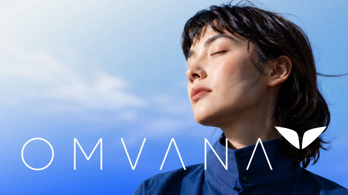 Omvana wordmark beside a portrait